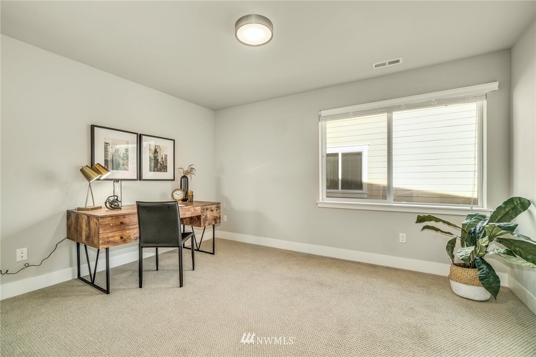 3318 238th Place Southeast Bothell, WA 98021 - Photo 18 of 36 a view of a livingroom with furniture and window