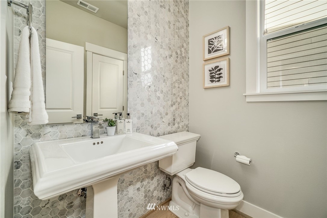 3318 238th Place Southeast Bothell, WA 98021 - Photo 20 of 36 a bathroom with a sink a toilet and a mirror