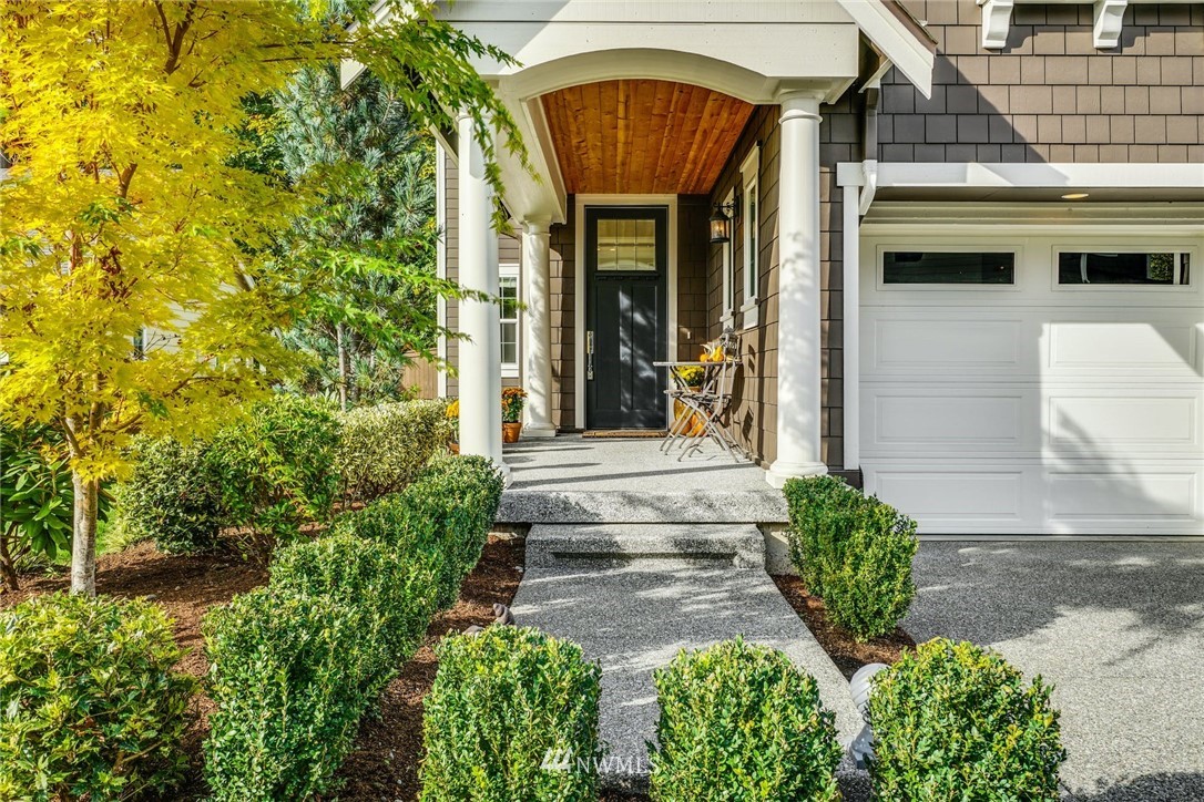 3318 238th Place Southeast Bothell, WA 98021 - Photo 3 of 36 a front view of a house with garden