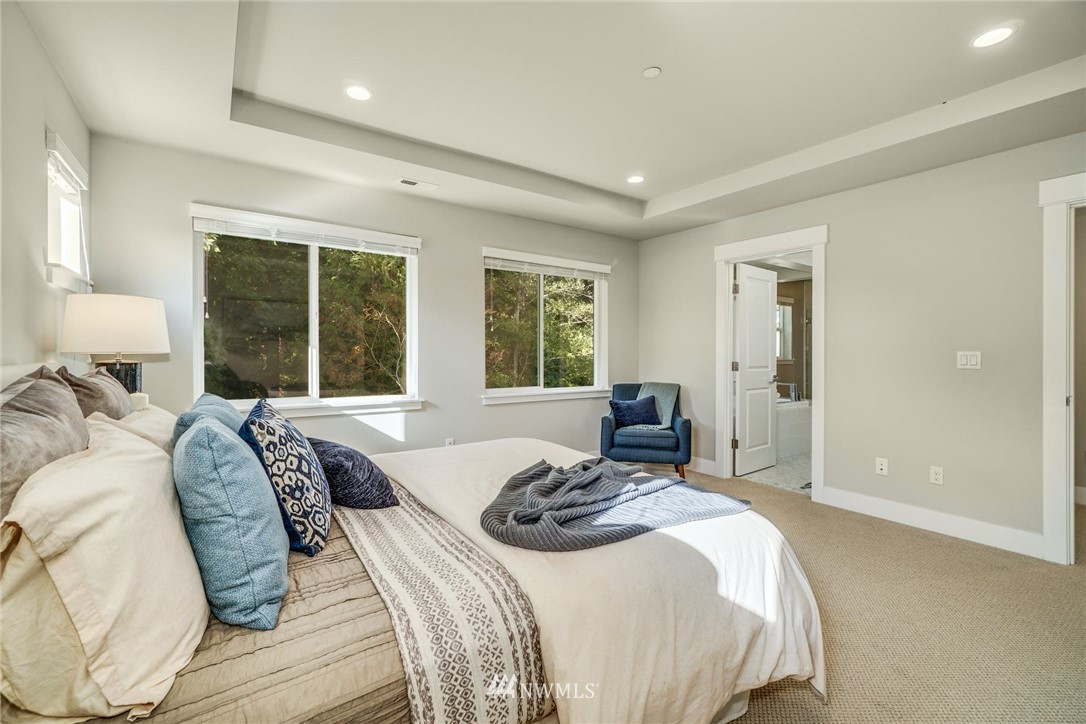 3318 238th Place Southeast Bothell, WA 98021 - Photo 22 of 36 a bedroom with a bed and a large window