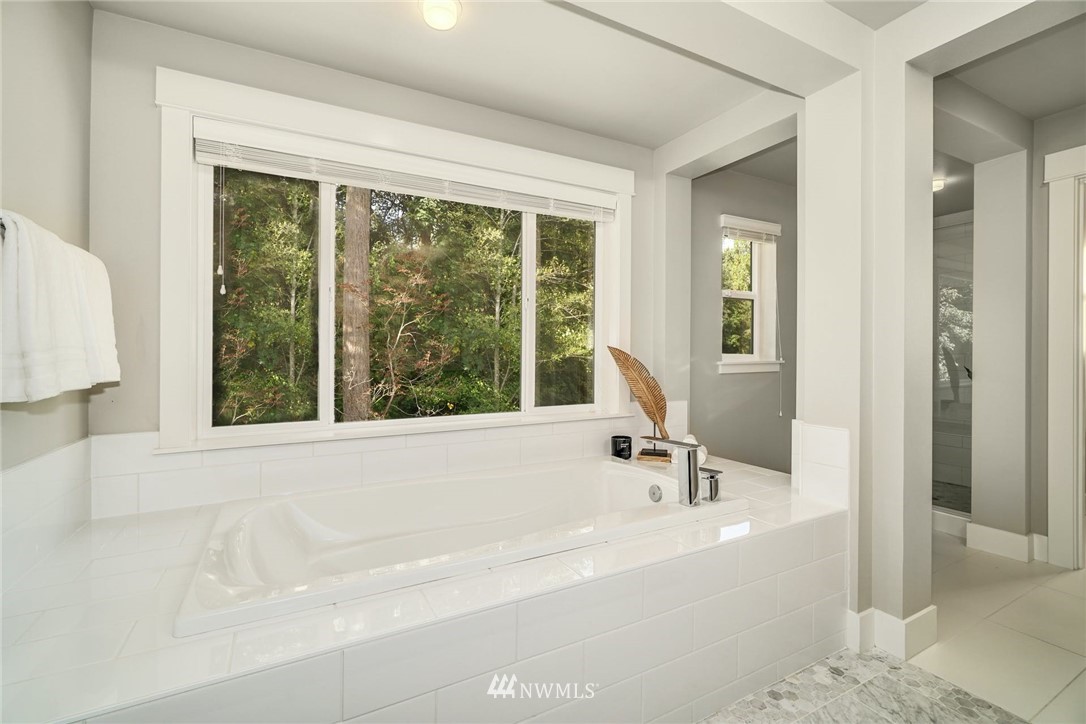 3318 238th Place Southeast Bothell, WA 98021 - Photo 24 of 36 a white bath tub sitting next to a window