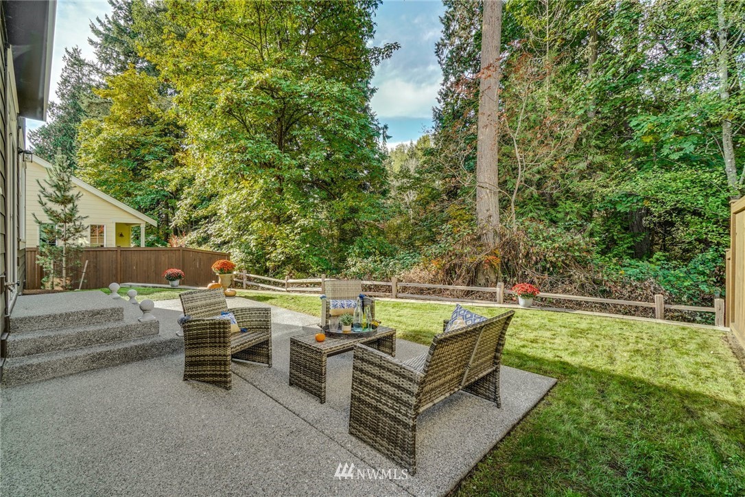 3318 238th Place Southeast Bothell, WA 98021 - Photo 27 of 36 a view of a patio with chairs and a table