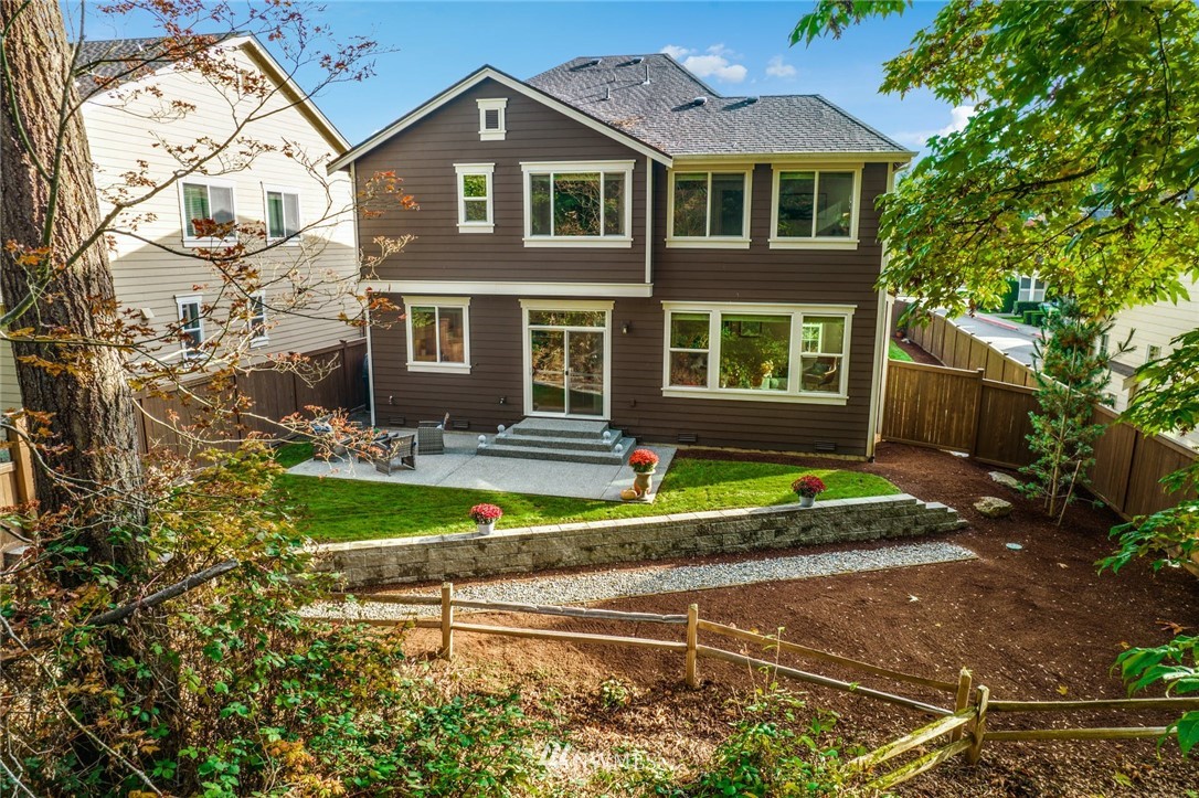 3318 238th Place Southeast Bothell, WA 98021 - Photo 29 of 36 a front view of a house with a yard