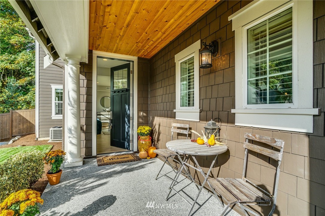 3318 238th Place Southeast Bothell, WA 98021 - Photo 4 of 36 a backyard of a house with table and chairs