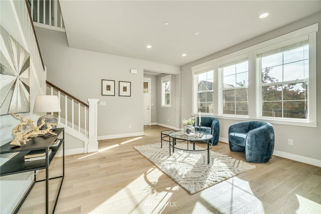 3318 238th Place Southeast Bothell, WA 98021 - Photo 7 of 36 a living room with furniture and a window