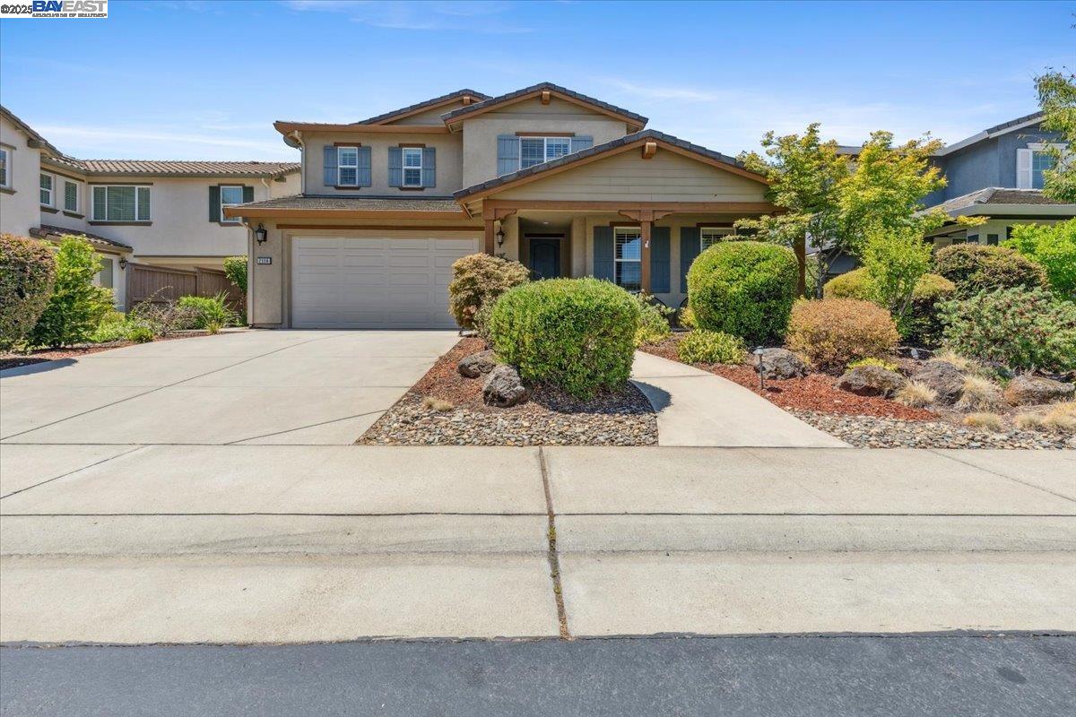 a front view of a house with garage