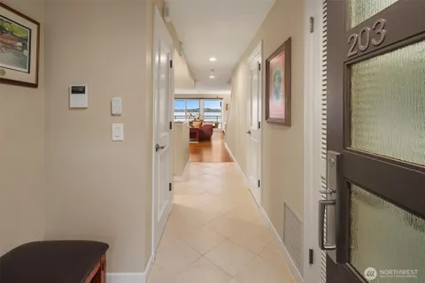 a view of a living room kitchen and a chandelier