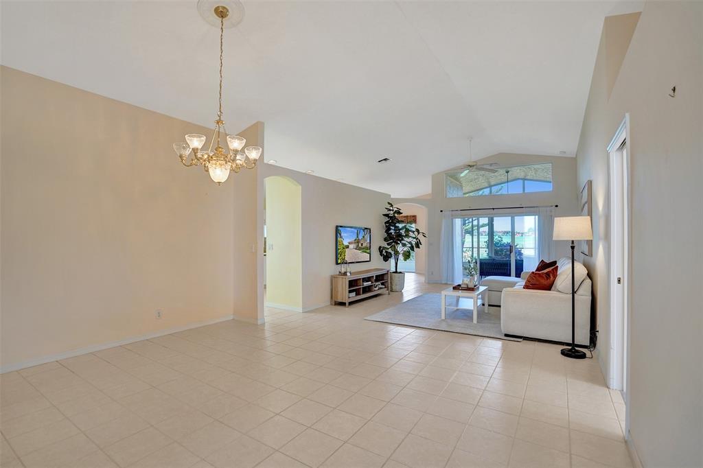 7219 Modena Drive Boynton Beach, FL 33437 - Photo 16 of 47 a view of a livingroom with furniture and a flat screen tv