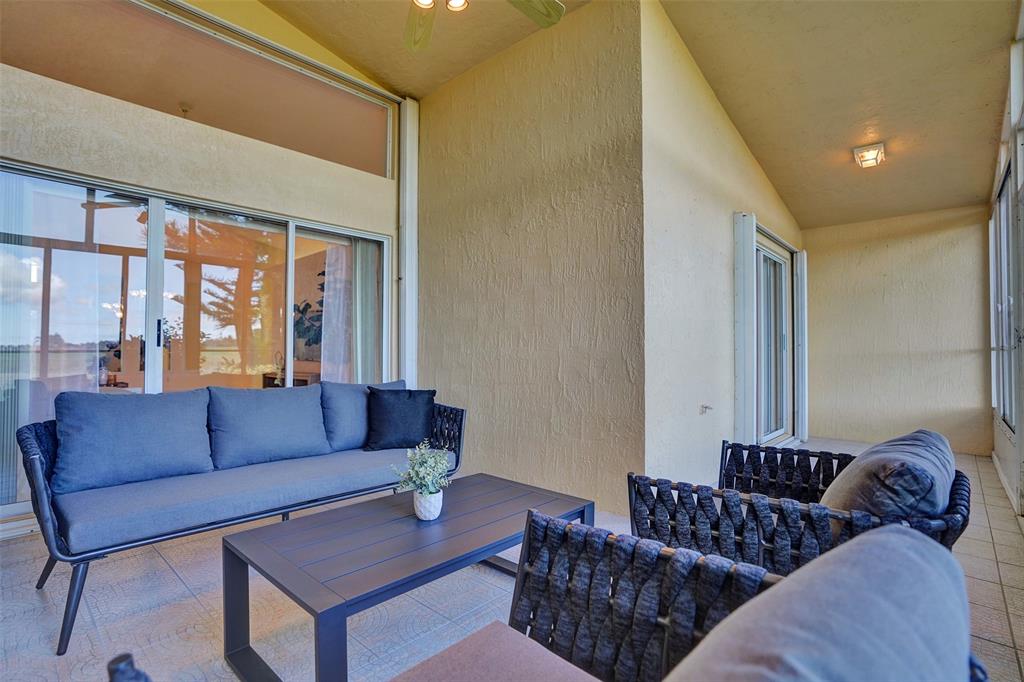 7219 Modena Drive Boynton Beach, FL 33437 - Photo 18 of 47 a living room with furniture and a large window