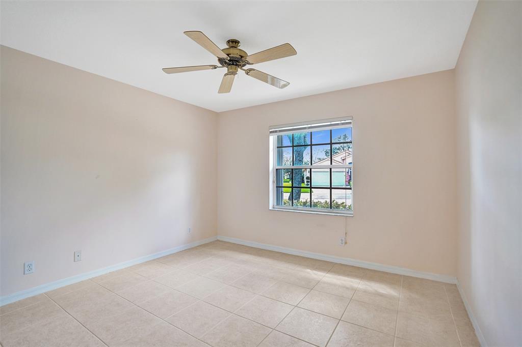 7219 Modena Drive Boynton Beach, FL 33437 - Photo 27 of 47 an empty room with a window and a fan