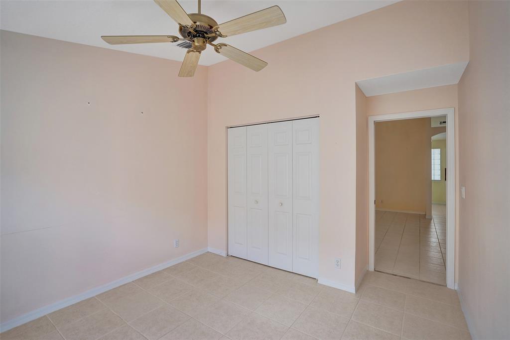 7219 Modena Drive Boynton Beach, FL 33437 - Photo 28 of 47 an empty room with a fan & a ceiling fan