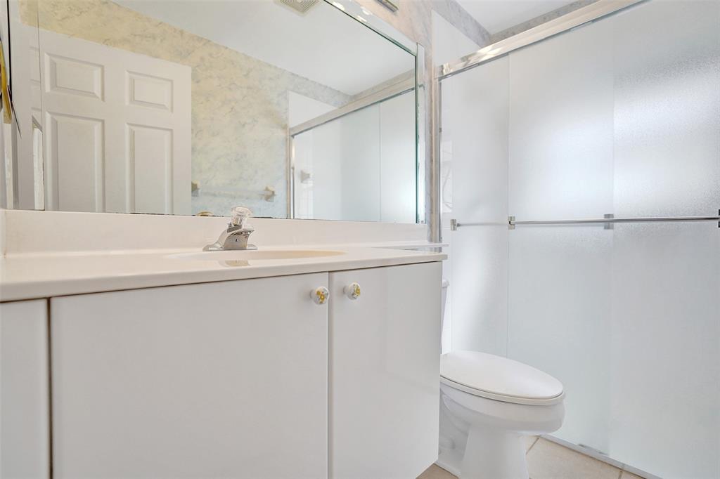 7219 Modena Drive Boynton Beach, FL 33437 - Photo 30 of 47 a bathroom with a sink toilet and shower