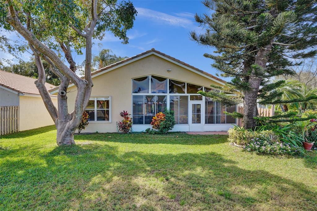 7219 Modena Drive Boynton Beach, FL 33437 - Photo 34 of 47 a view of a house with a yard and sitting area