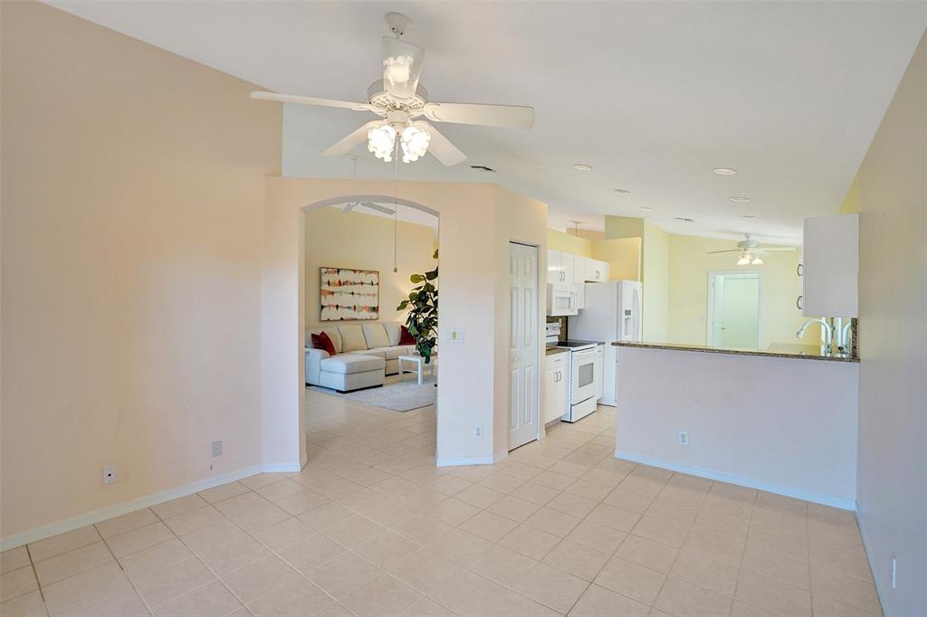 7219 Modena Drive Boynton Beach, FL 33437 - Photo 10 of 47 a view of a living room and chandelier