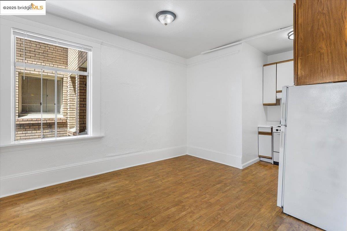 498 25th Street Oakland, CA 94612 - Photo 15 of 44 a view of an empty room with a window