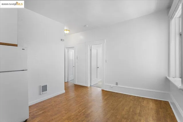 a kitchen with a sink cabinets and a window