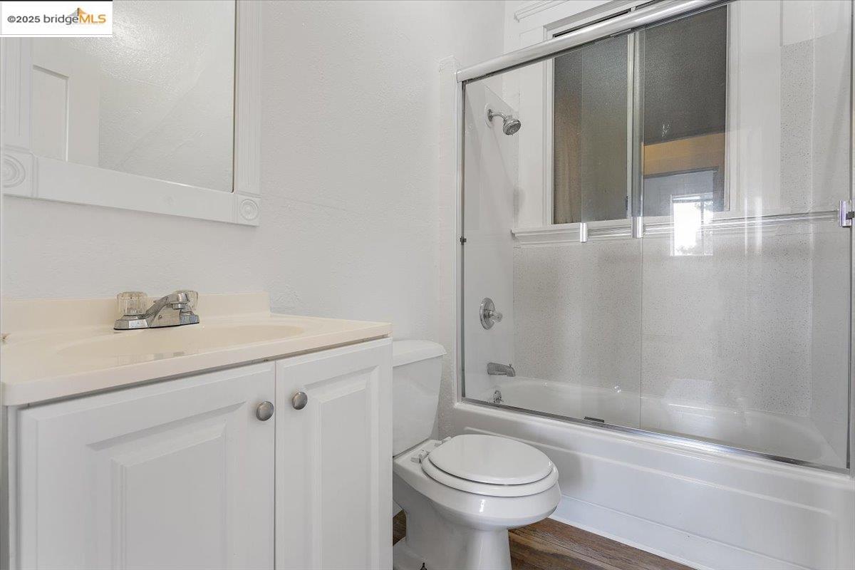 498 25th Street Oakland, CA 94612 - Photo 23 of 44 a bathroom with a sink a toilet and shower