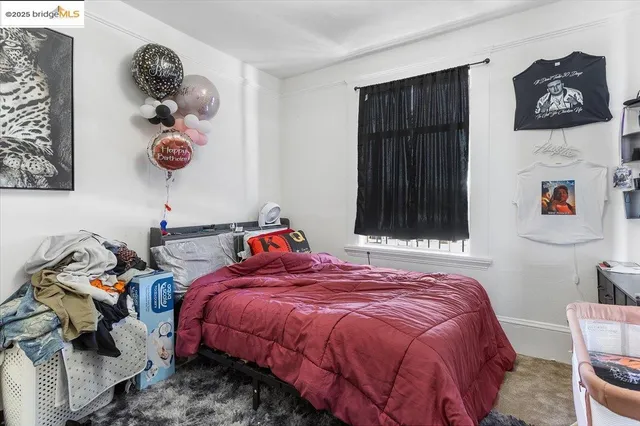 a bed room with a bed and a window