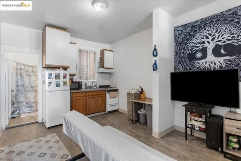 a bedroom with furniture and a flat screen tv