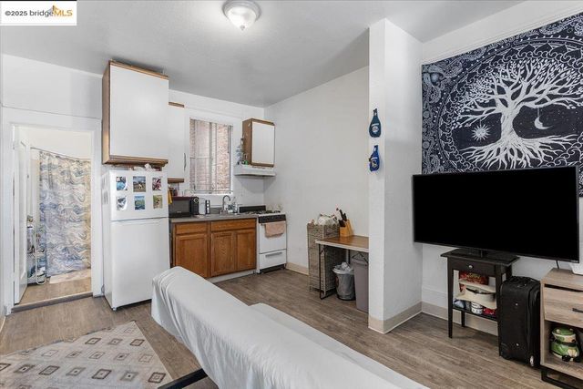 a bedroom with furniture and a flat screen tv