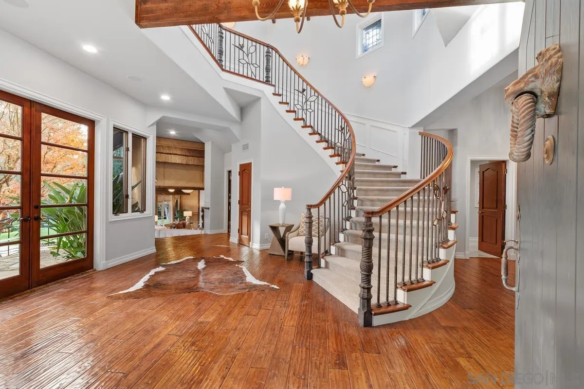6281 Avenida Loma De Oro Rancho Santa Fe, CA 92067 - Photo 11 of 40 a view of entryway and hall with wooden floor