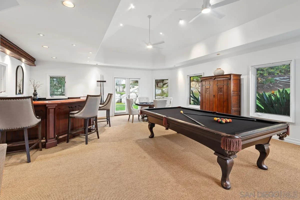 6281 Avenida Loma De Oro Rancho Santa Fe, CA 92067 - Photo 15 of 40 a living room with furniture a rug and a table