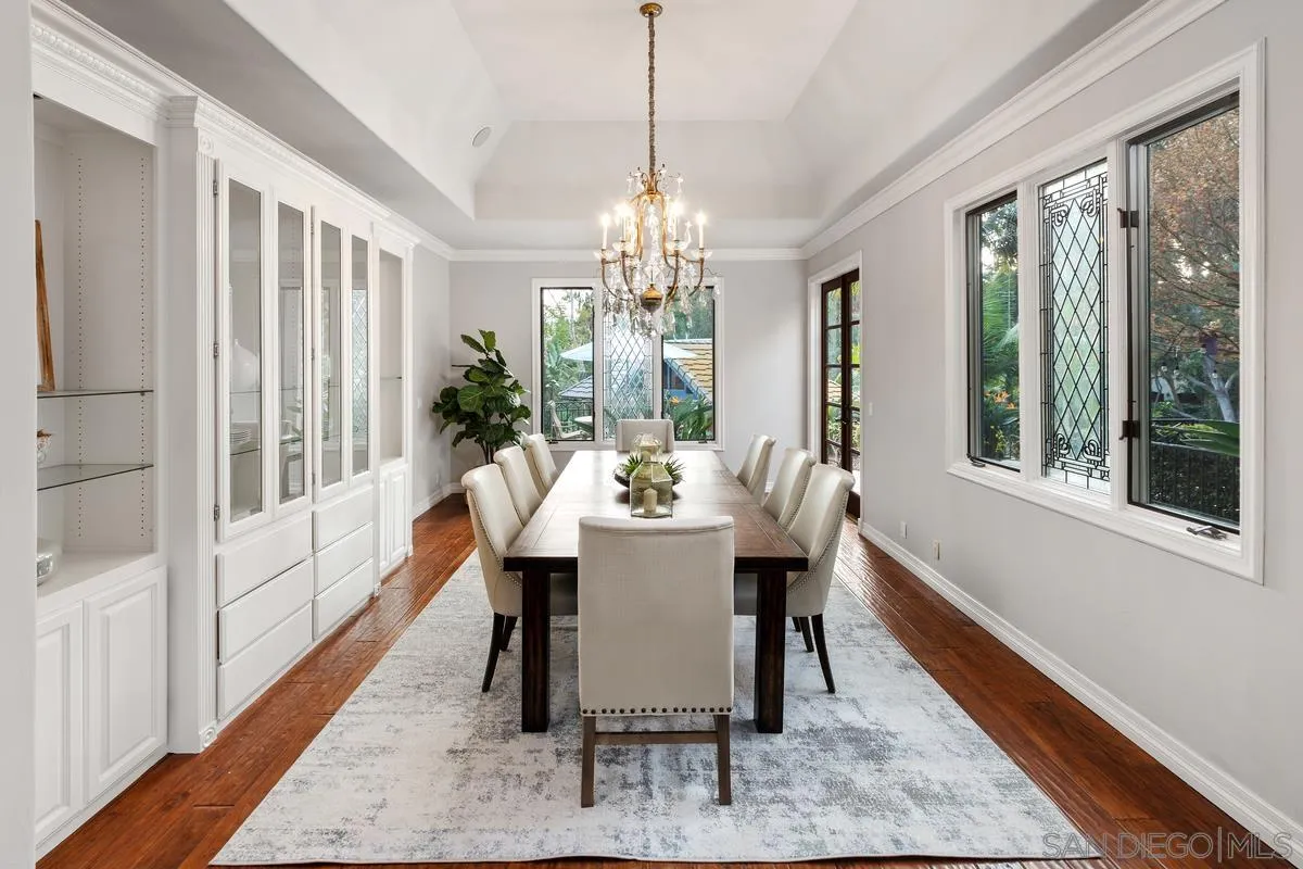 6281 Avenida Loma De Oro Rancho Santa Fe, CA 92067 - Photo 16 of 40 a dining room with furniture a chandelier and wooden floor