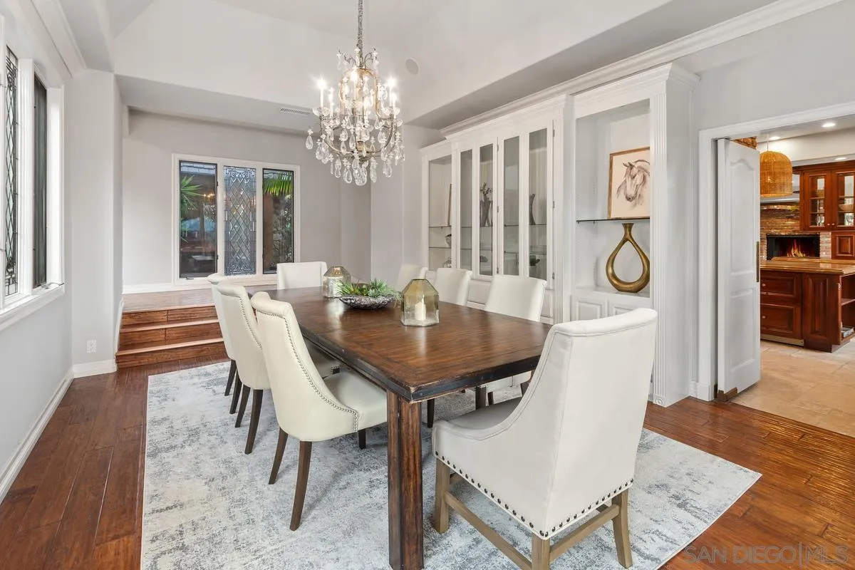 6281 Avenida Loma De Oro Rancho Santa Fe, CA 92067 - Photo 17 of 40 a view of a dining room with furniture and chandelier