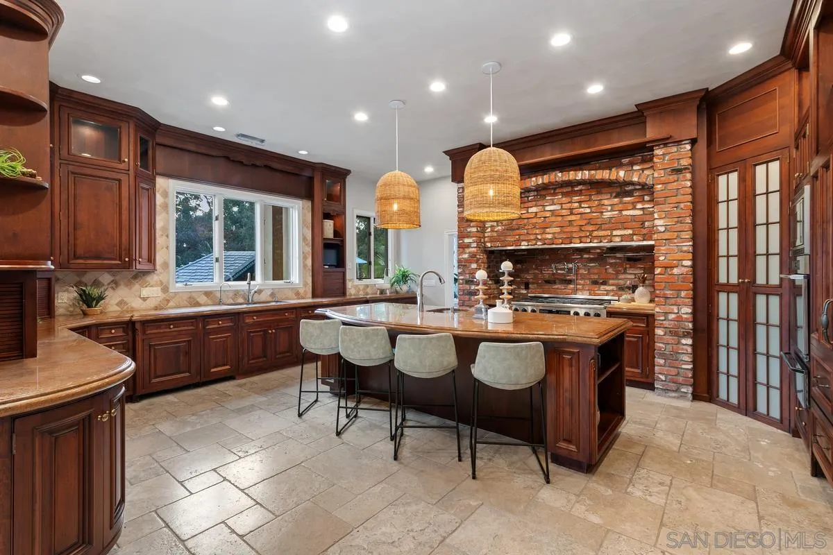 6281 Avenida Loma De Oro Rancho Santa Fe, CA 92067 - Photo 18 of 40 a dining hall with stainless steel appliances granite countertop a sink and a refrigerator