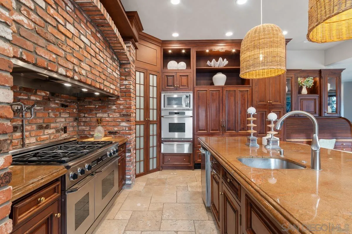 6281 Avenida Loma De Oro Rancho Santa Fe, CA 92067 - Photo 20 of 40 a kitchen with stainless steel appliances granite countertop a sink and stove