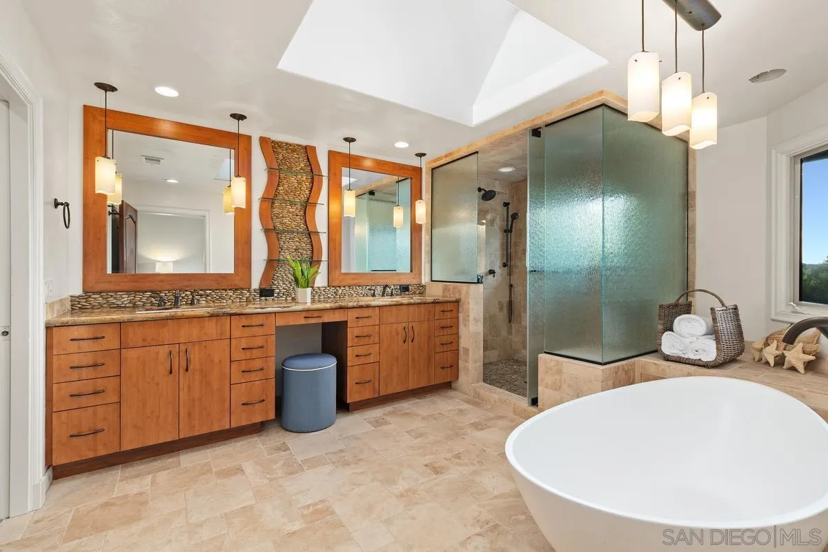 6281 Avenida Loma De Oro Rancho Santa Fe, CA 92067 - Photo 25 of 40 a bathroom with a sink double vanity and a mirror