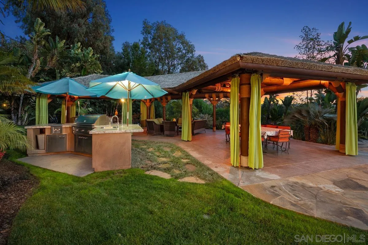 6281 Avenida Loma De Oro Rancho Santa Fe, CA 92067 - Photo 6 of 40 a view of a house with backyard and sitting area