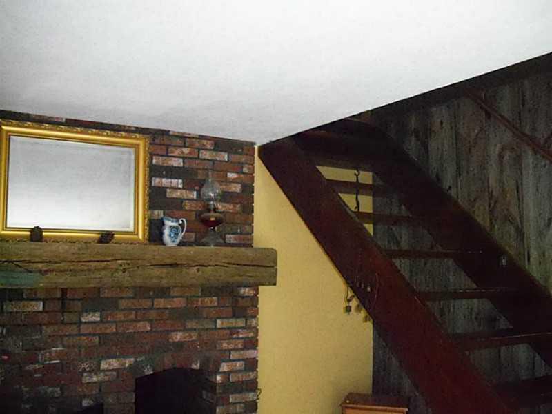 784 Lawrence Road Pownal, ME 04069 - Photo 7 of 13 Living Room. Fireplace