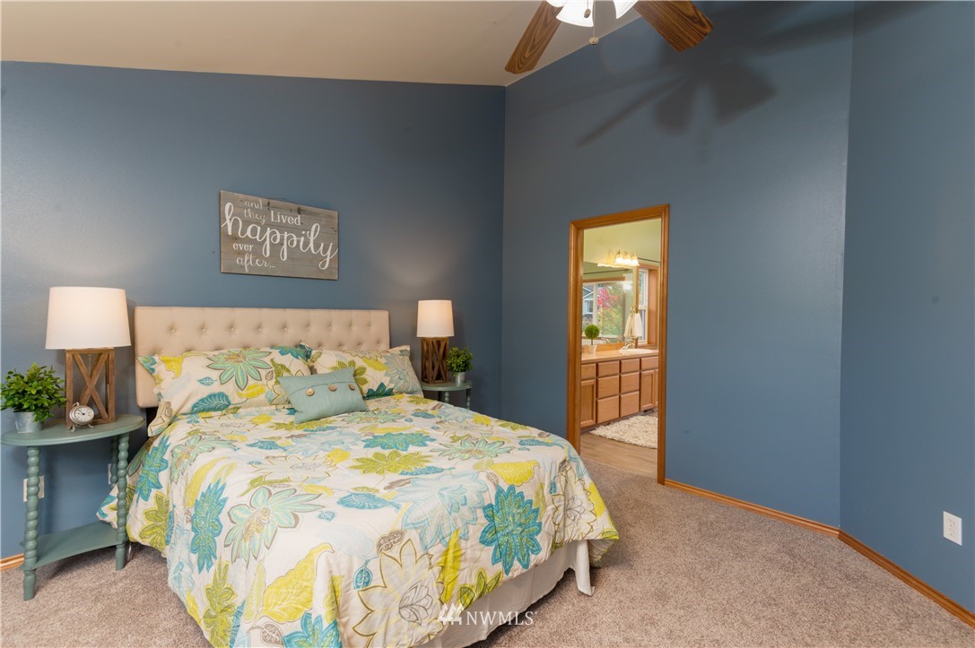 1220 Southwest 12th Street North Bend, WA 98045 - Photo 11 of 25 a bedroom with a bed and a night stand