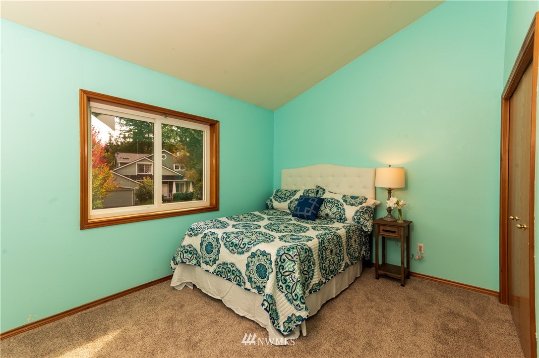 1220 Southwest 12th Street North Bend, WA 98045 - Photo 13 of 25 a bedroom with a bed and window