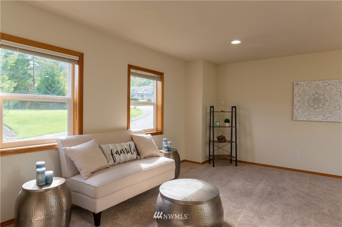 1220 Southwest 12th Street North Bend, WA 98045 - Photo 16 of 25 a living room with furniture and a large window