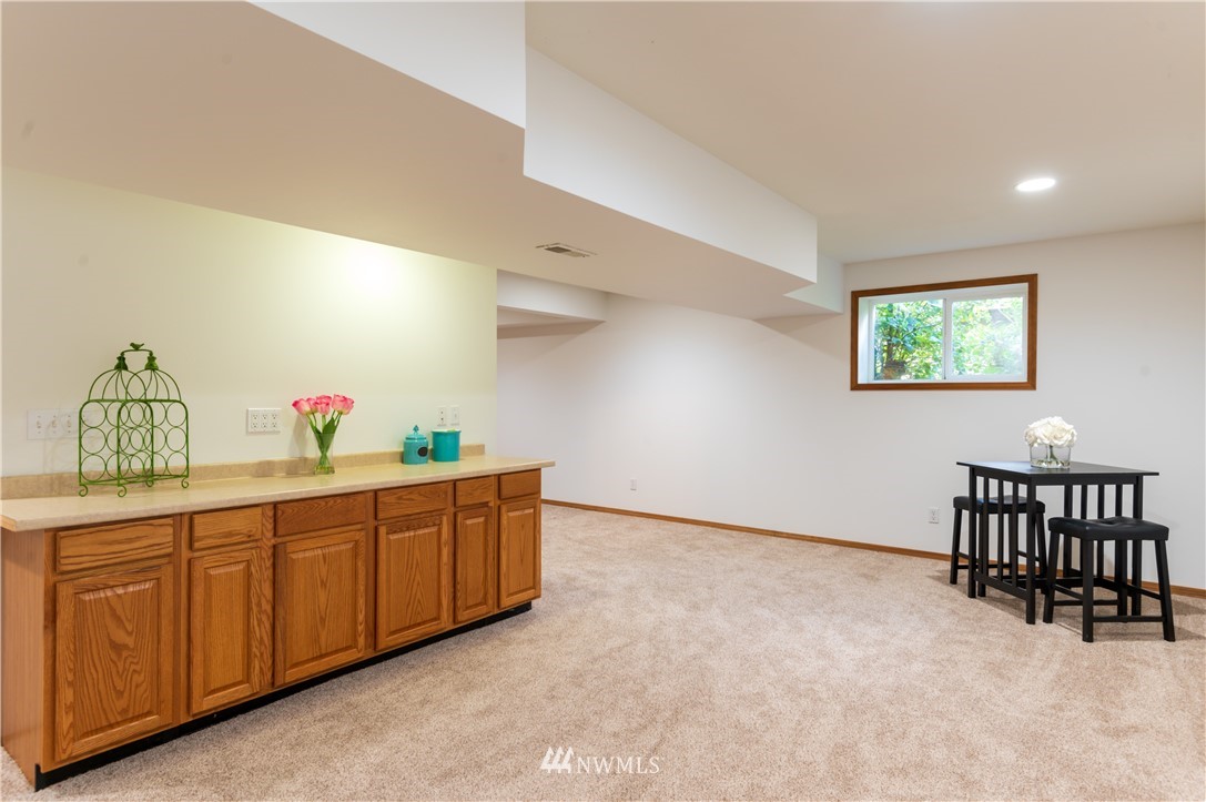 1220 Southwest 12th Street North Bend, WA 98045 - Photo 18 of 25 a kitchen with stainless steel appliances granite countertop a sink and a cabinets