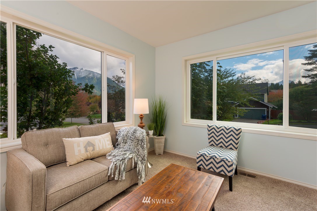1220 Southwest 12th Street North Bend, WA 98045 - Photo 4 of 25 a living room with furniture and a large window