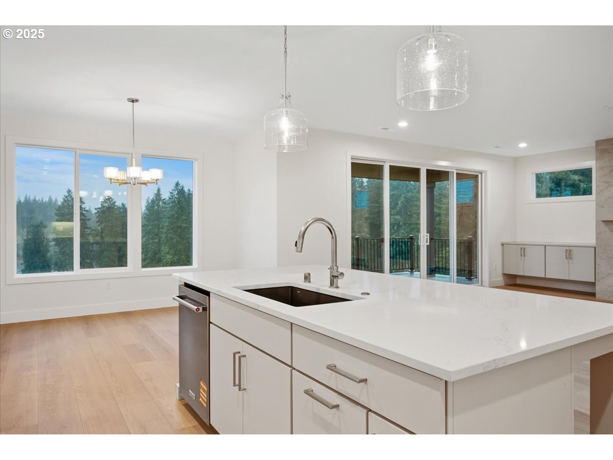 3510 North 11th Circle Ridgefield, WA 98642 - Photo 13 of 47 a kitchen with a sink and a large window