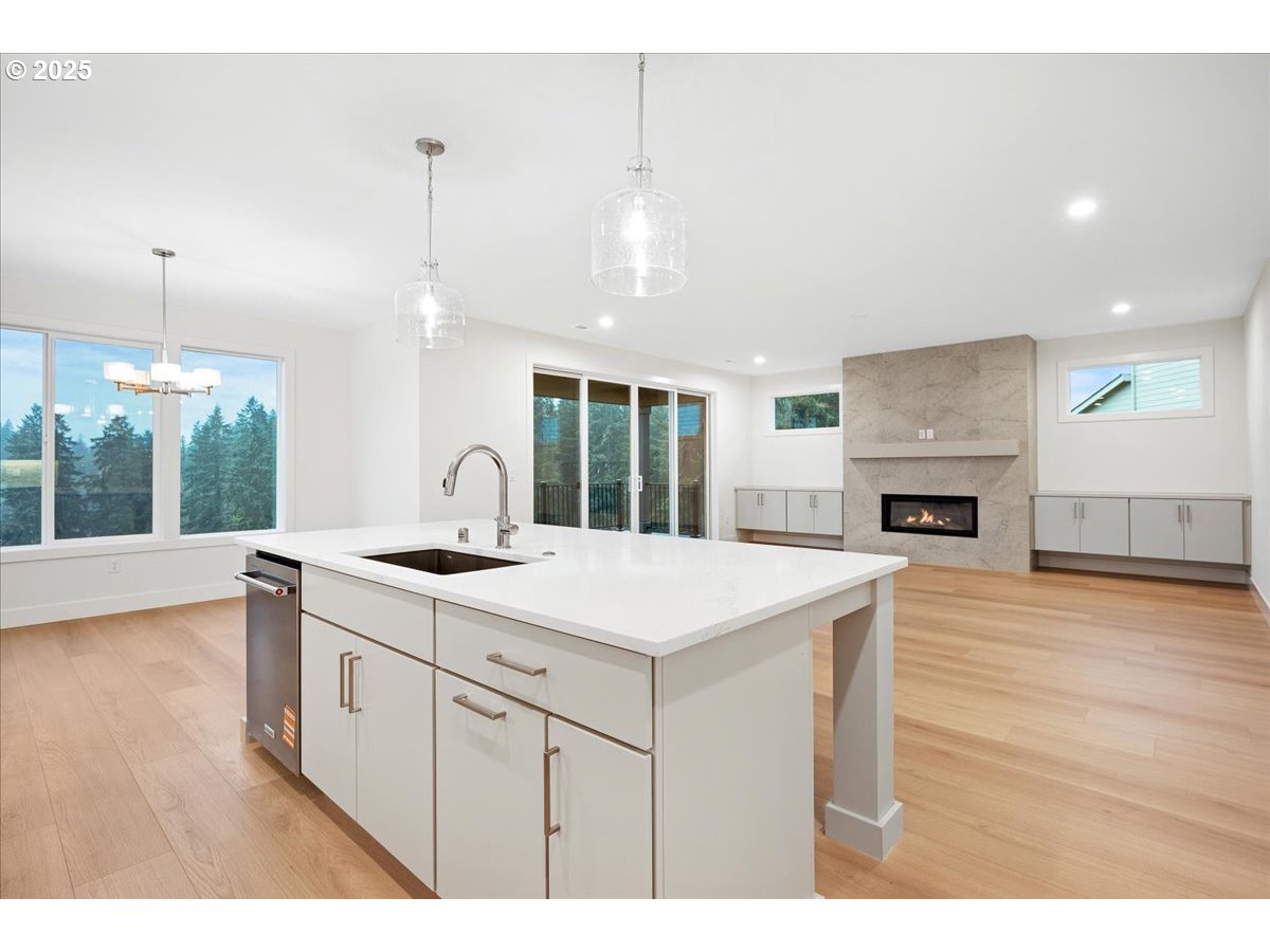 3510 North 11th Circle Ridgefield, WA 98642 - Photo 14 of 47 a kitchen with a stove and a wooden floor