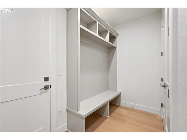 a view of room with hallway and closet