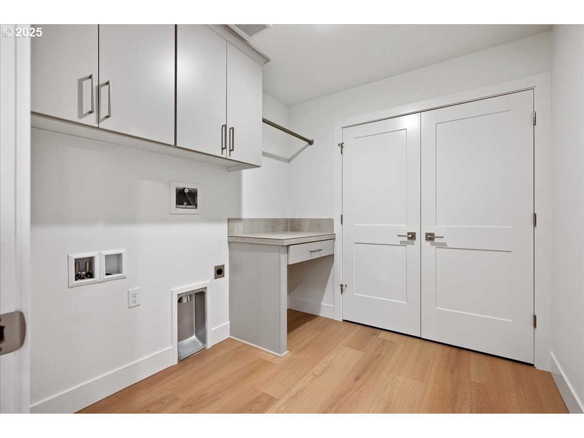 3510 North 11th Circle Ridgefield, WA 98642 - Photo 36 of 47 a kitchen with cabinets and wooden floor