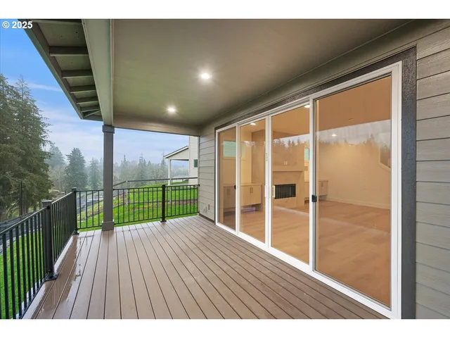 a view of balcony with floor to ceiling window