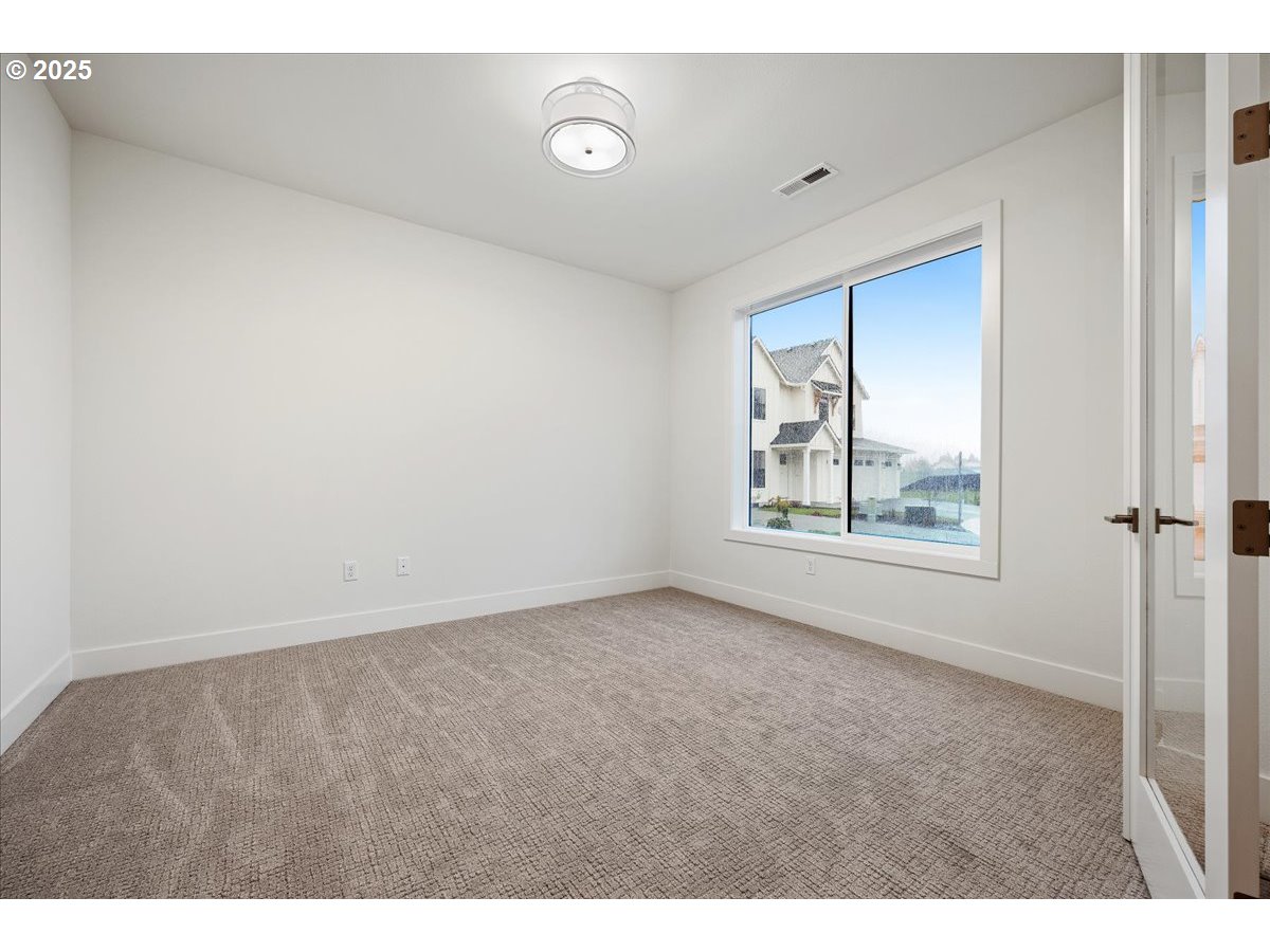 3510 North 11th Circle Ridgefield, WA 98642 - Photo 4 of 47 a view of an empty room with window