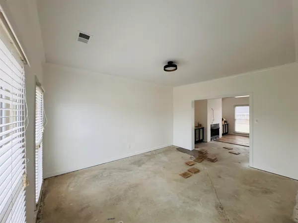 a view of empty room with windows