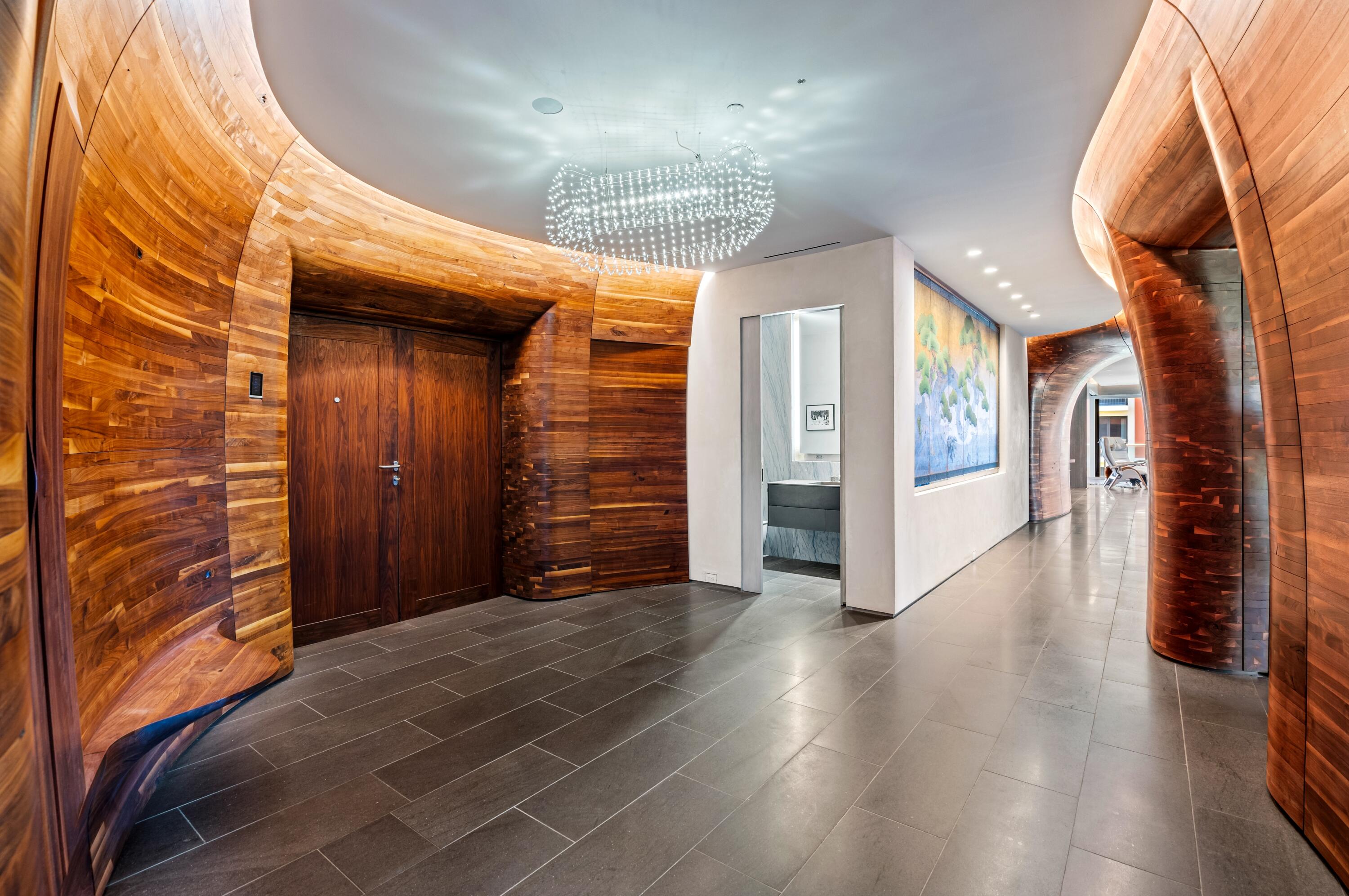2 North Breakers Row, Unit N25 Palm Beach, FL 33480 - Photo 14 of 79 a view of a hallway with wooden floor and staircase