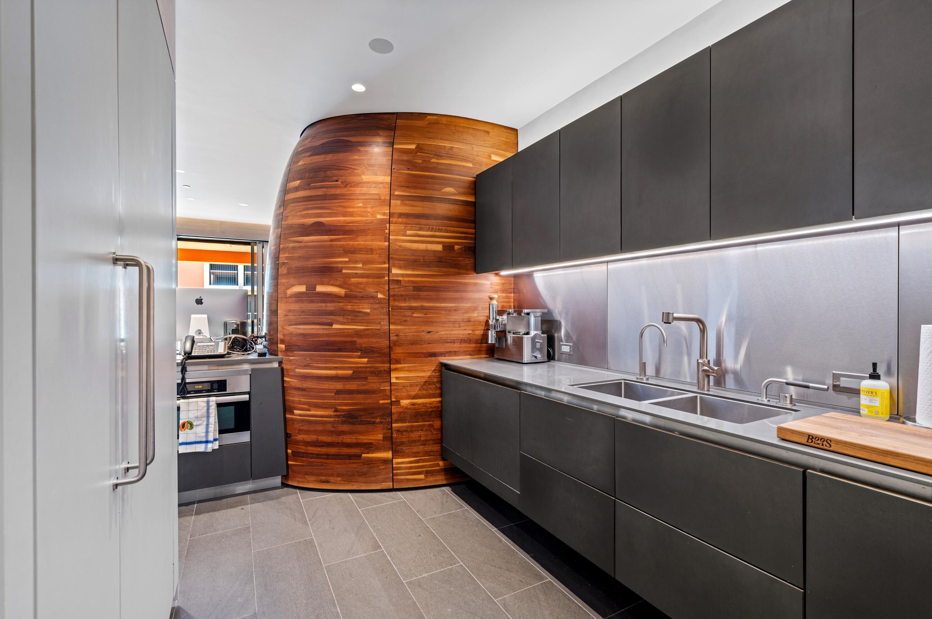 2 North Breakers Row, Unit N25 Palm Beach, FL 33480 - Photo 17 of 79 a kitchen with stainless steel appliances a refrigerator and sink