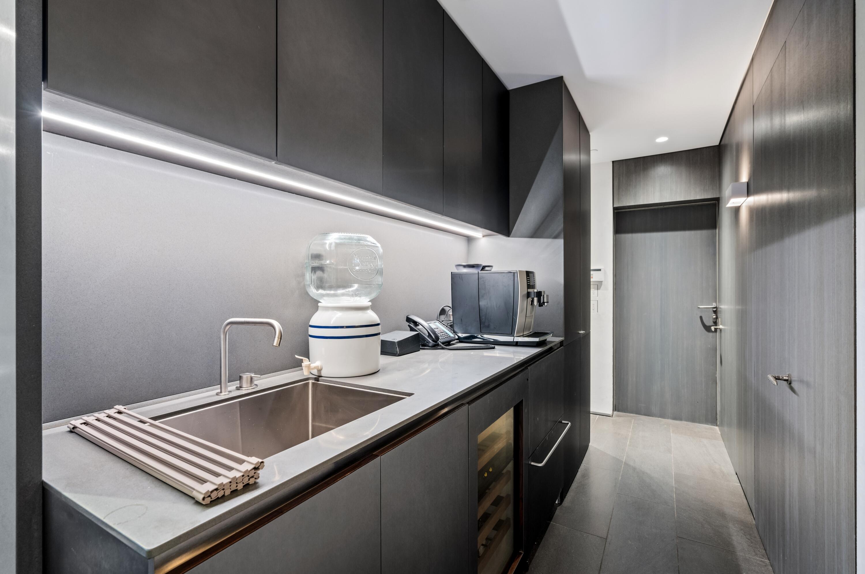 2 North Breakers Row, Unit N25 Palm Beach, FL 33480 - Photo 20 of 79 a kitchen with a sink and refrigerator