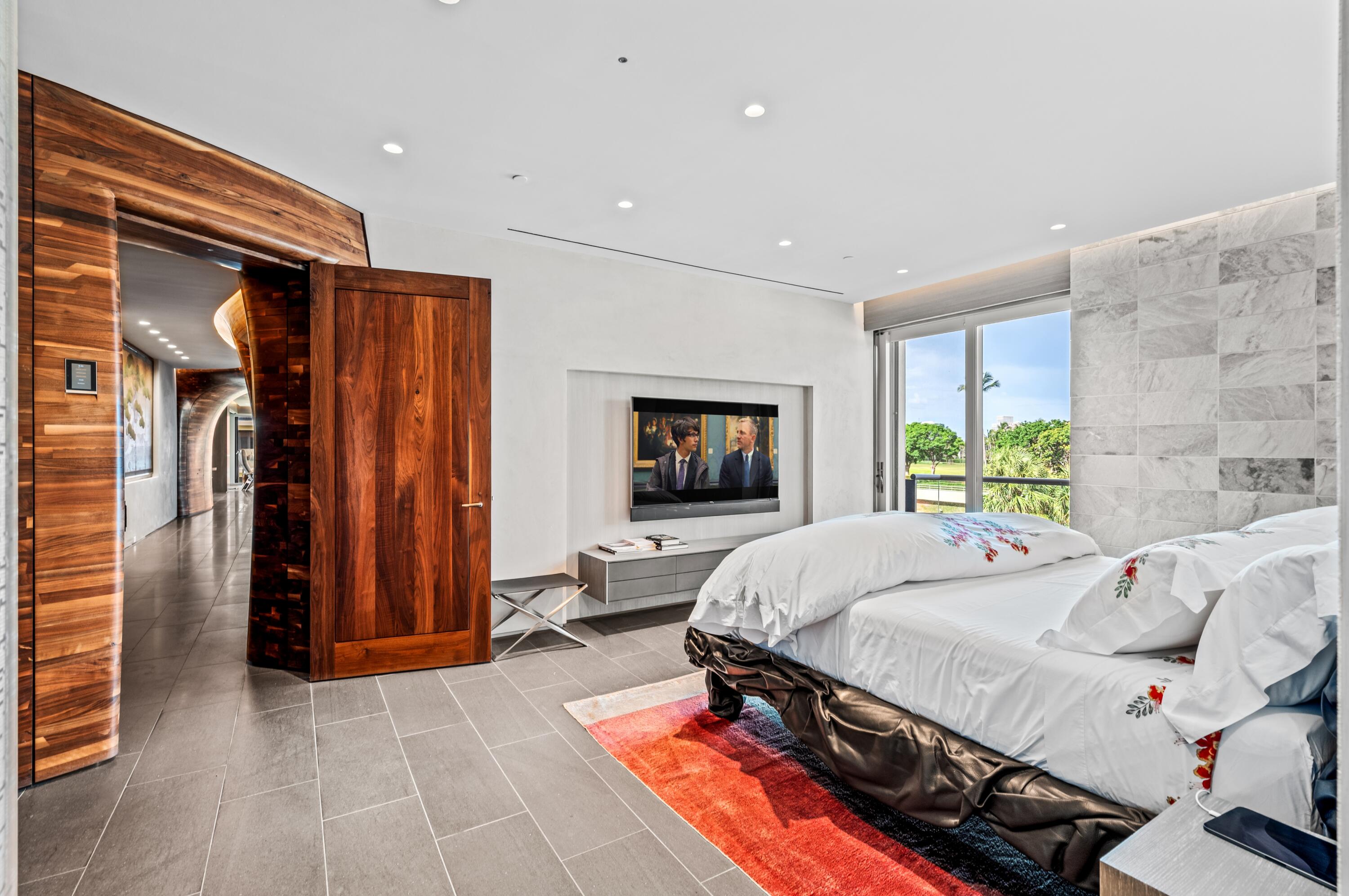 2 North Breakers Row, Unit N25 Palm Beach, FL 33480 - Photo 21 of 79 a bed room with a bed and a television