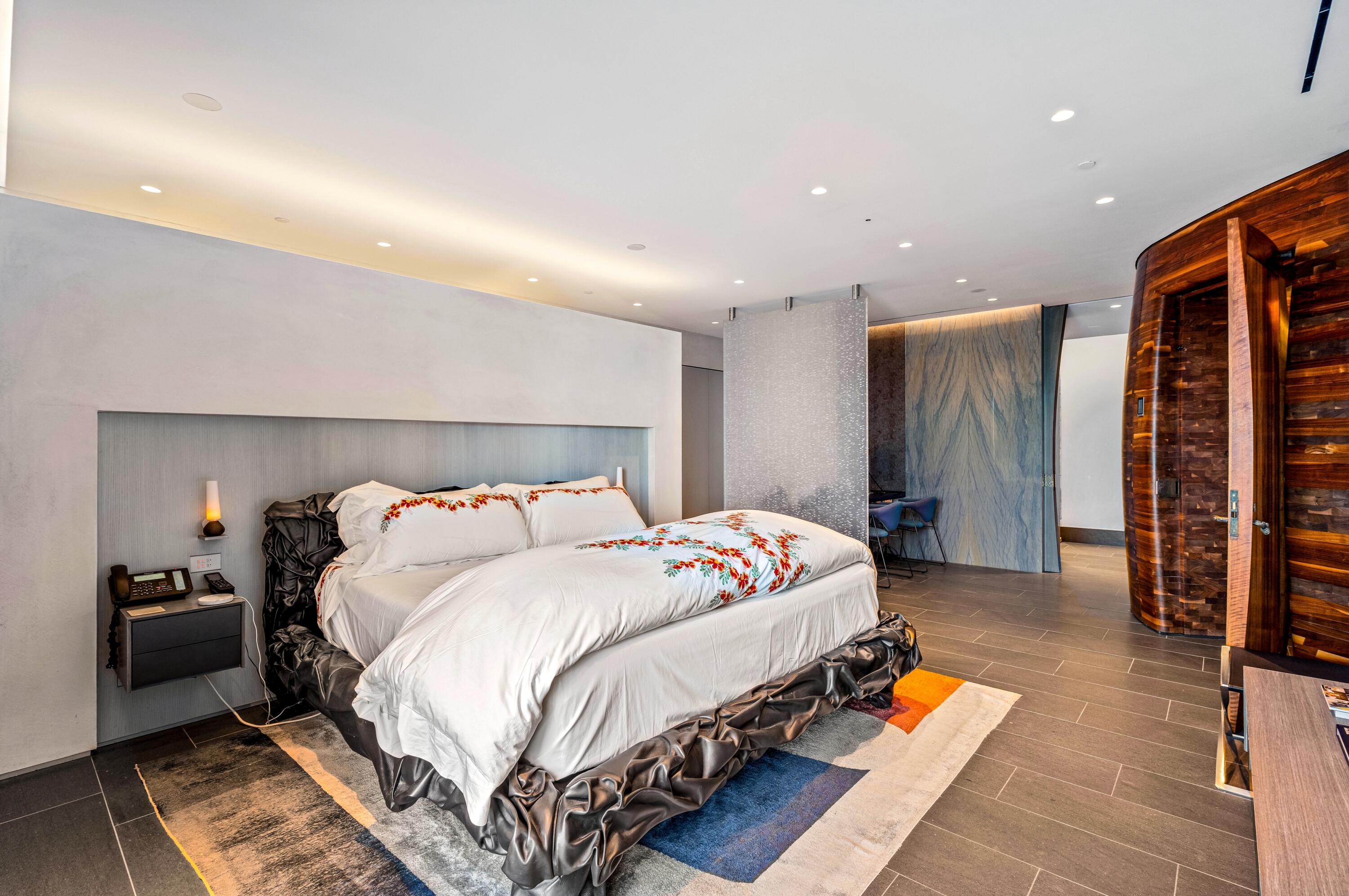 2 North Breakers Row, Unit N25 Palm Beach, FL 33480 - Photo 24 of 79 a bedroom with bed and a couch